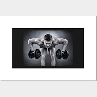 Athletic man working with heavy dumbbells Posters and Art